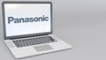 Opening and closing laptop with Panasonic Corporation logo on the screen. Computer technology conceptual editorial 4K