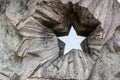 Opening in the concrete wall in the shape of Soviet five-pointed star