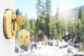 Opening door with golden house key chain on blurry green background and mock up place for your advertisement. Home purchase Royalty Free Stock Photo