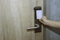 Opening door of room in hotel by proximity card, keyless to authenticate Royalty Free Stock Photo