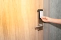 Opening door of room in hotel by proximity card, keyless to authenticate Royalty Free Stock Photo