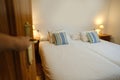 opening door to bright room open, Cozy Beds in Hotel, Serene Sleep Haven, Soft Hotel Pillows and Bedding, Rejuvenating Hotel Stay