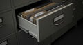 Opening File Cabinet Drawer Revealing Documents and Folders Organized Neatly