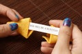 Opening A Fortune Cookie Royalty Free Stock Photo