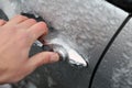 Opening a frozen car door Royalty Free Stock Photo