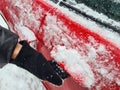 Opening frozen car door in winter closeup