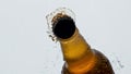 Opening glass ipa bottle closeup. Unfiltered beer splashing condensating flask Royalty Free Stock Photo