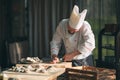 Opening the hollow and flat oysters. Chef opens oysters in the restaurant. Royalty Free Stock Photo