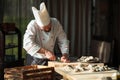 Opening the hollow and flat oysters. Chef opens oysters in the restaurant. Royalty Free Stock Photo