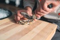 Opening the hollow and flat oysters. Chef opens oysters in the restaurant. Royalty Free Stock Photo