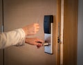 Opening a hotel door with keyless entry card Royalty Free Stock Photo