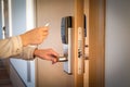 Opening a hotel door with keyless entry card Royalty Free Stock Photo