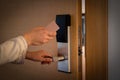 Opening a hotel door with keyless entry card Royalty Free Stock Photo