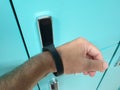 opening the locker with an electro-magnetic bracelet.