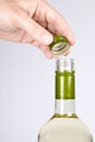 Opening a Screwcap on a Bottle of White Wine Royalty Free Stock Photo