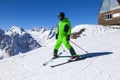 Opening of a ski resort, a young man on skis against the backdrop of mountains. Aerial view Royalty Free Stock Photo