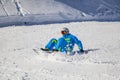 Opening of a ski resort, a young man on a snowboard on a background of mountains Royalty Free Stock Photo