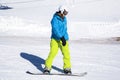 Opening of a ski resort, a young man on a snowboard on a background of mountains. Russia, Sochi Royalty Free Stock Photo