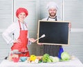 Opening soon. Hiring staff. Woman and man chef hold blackboard copy space. Job position. Cooking delicious meal recipe Royalty Free Stock Photo