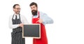 Opening soon. Men bearded bartender or cook in apron hold blank chalkboard. Workers wanted. Bartender with blackboard Royalty Free Stock Photo