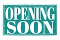 OPENING SOON, words on blue grungy stamp sign