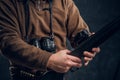 Closeup on hands. Opening of the spring hunting season. Hunter ready to hunt and charging a hunting rifle Royalty Free Stock Photo