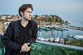 Opening of tourist season in Antalya, young European man looks at sea from an observation deck. Royalty Free Stock Photo