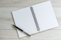 Opening white blank note paper and pen on the left with on light Royalty Free Stock Photo