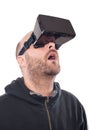 Openmouthed and excited man play game with virtual reality device