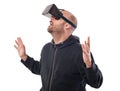 Openmouthed and excited man play game with virtual reality device