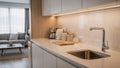 Openplan kitchen corner in serviced apartment highlighted with focused appliances and countertop seamlessly blending Royalty Free Stock Photo