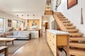 openspace saltbox home interior with floating staircase Royalty Free Stock Photo
