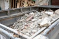 opentop steel dumpster filled with demolition debris Royalty Free Stock Photo