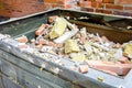 opentop steel dumpster filled with demolition debris Royalty Free Stock Photo