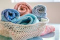 openweave fabric basket with rolledup beach towels inside Royalty Free Stock Photo