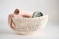 openweave fabric basket with rolledup beach towels inside Royalty Free Stock Photo