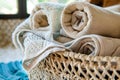 openweave fabric basket with rolledup beach towels inside Royalty Free Stock Photo