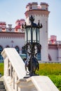 Openwork forged lantern on a sunny day