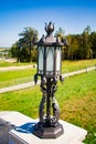 Openwork forged lantern on a sunny day