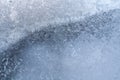 Openwork icy drawing on frozen window glass as background or wallpaper. Royalty Free Stock Photo