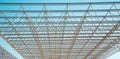 Openwork metal construction on a blue sky background on a clear sunny day, texture backgrounds for graphic design. Royalty Free Stock Photo