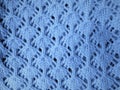 Openwork pattern of blue yarn.