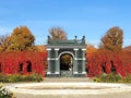 Openwork pavilion framed by autumn foliage