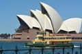 The Opera House with a ferry that sails out from Circular Quay i