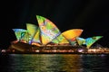 Opera house in summer colours of lime, aqua, yellow and orange