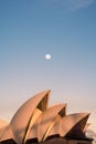 the opera house under a full moon at dusk on sydney Royalty Free Stock Photo