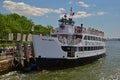 Visitors & tourists are queuing to board or get off at Battery Park stop for docking Statue Cruises ferry service