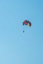 The operated parachute flies in high in the blue sky Royalty Free Stock Photo