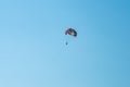 The operated parachute flies in high in the blue sky Royalty Free Stock Photo