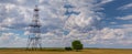 Operating oil and gas well profiled on cloudy sky Royalty Free Stock Photo